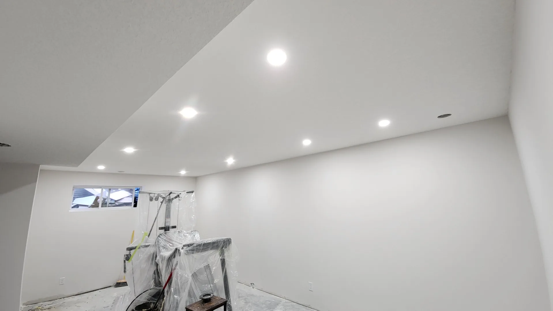 Finished basement with recessed lighting