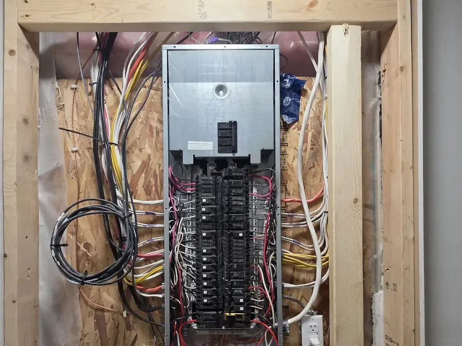 The old grey electrical panel before the upgrade